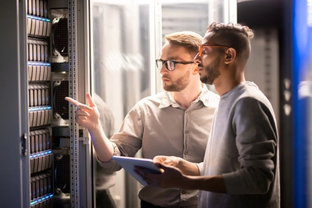 Two men standing in a data center